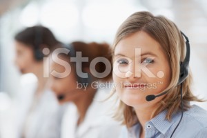 stock-photo-12604976-cute-female-call-centre-employee-with-headset