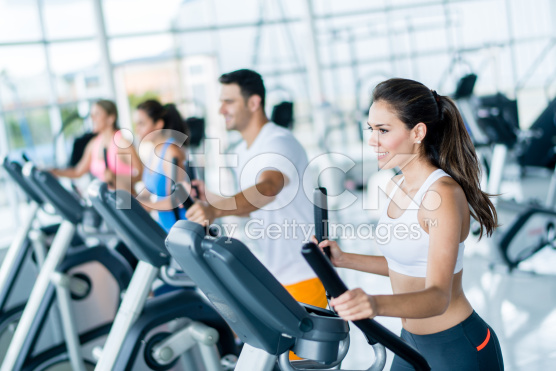 stock-photo-52750796-gym-people-on-cross-trainers
